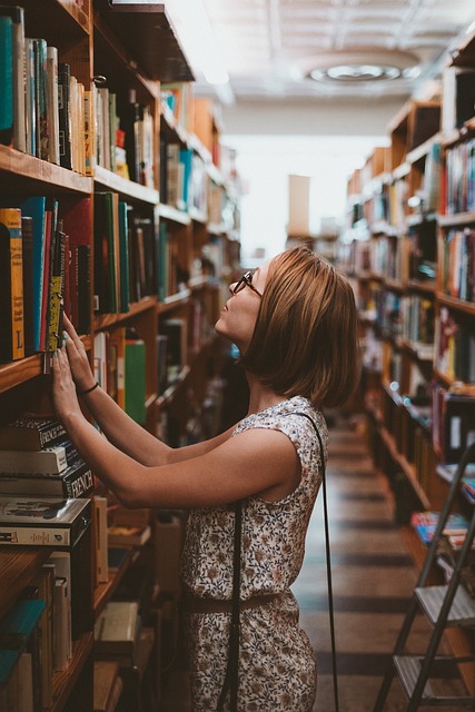 Woman looking at books on the shelf